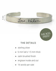 Silver bracelet with engraved text on a white background