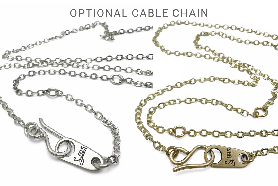Silver and brass cable chain necklaces on a white background