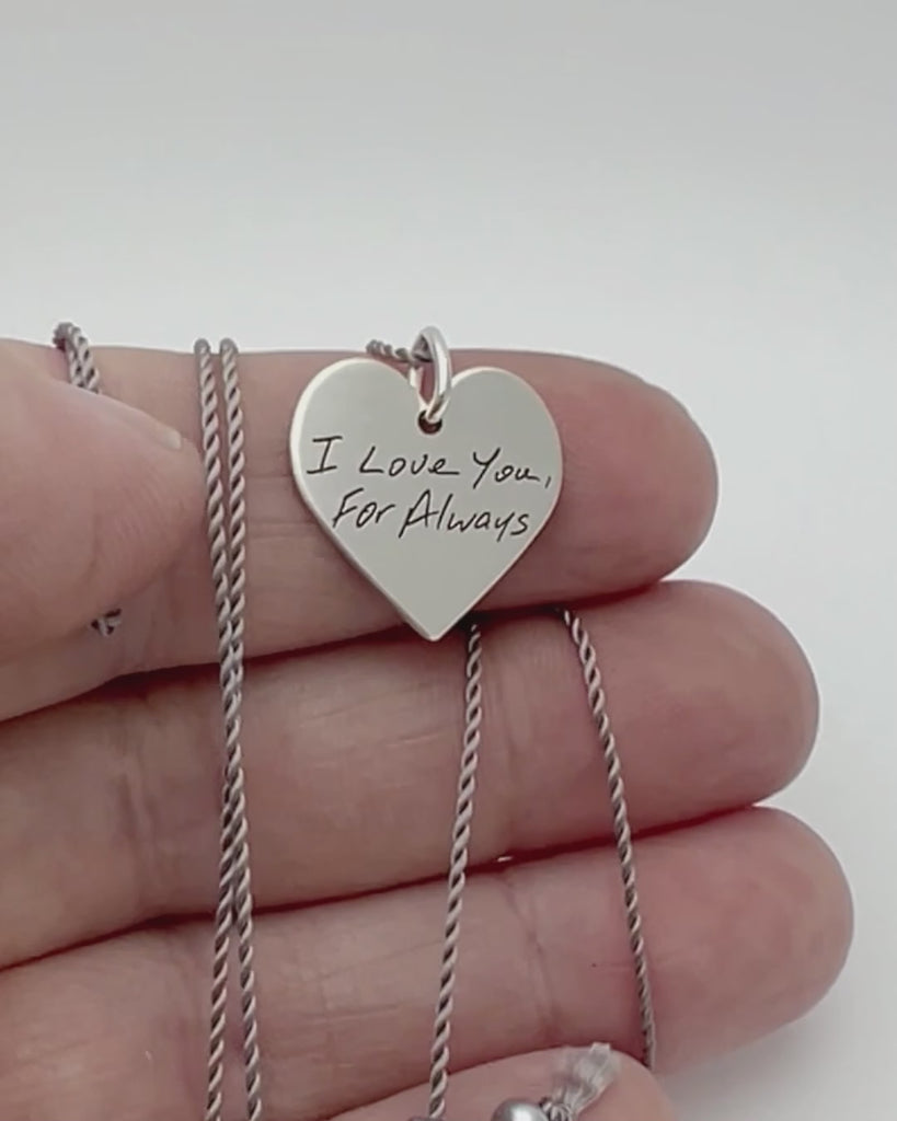 Silver heart shaped handwriting engraved necklace. Showing front and back engraving. 